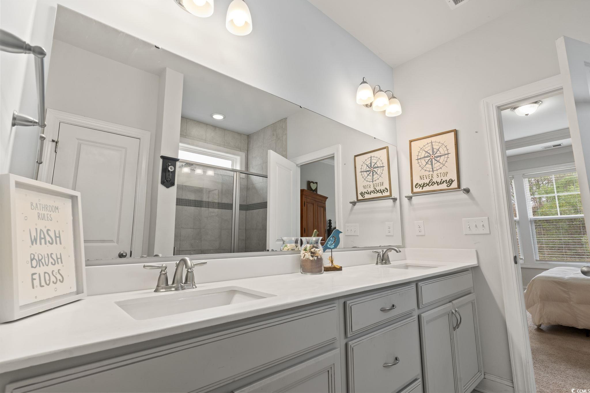 144 Bucky Loop Murrells Inlet, SC 29576 - Photo 26 of 40 Bathroom with a shower with door and vanity