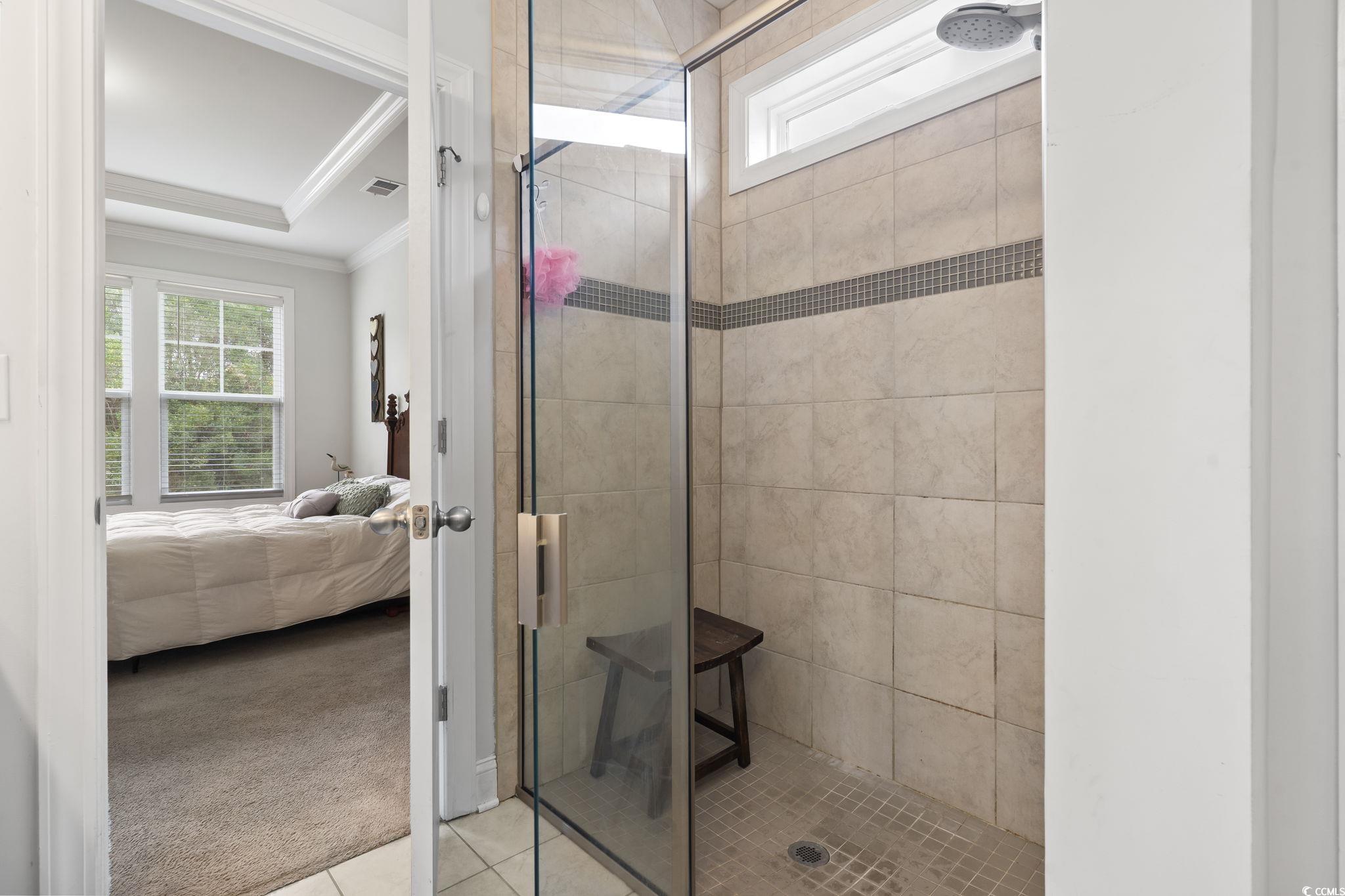 144 Bucky Loop Murrells Inlet, SC 29576 - Photo 27 of 40 Bathroom featuring tiled shower, tile patterned fl