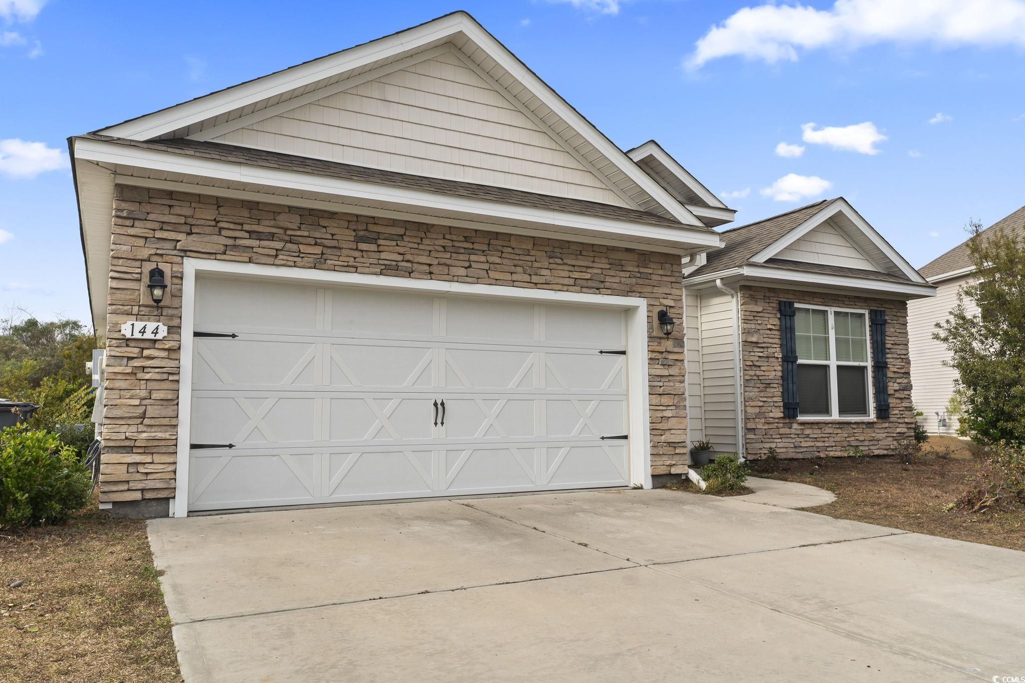 144 Bucky Loop Murrells Inlet, SC 29576 - Photo 3 of 40 View of front facade with a garage