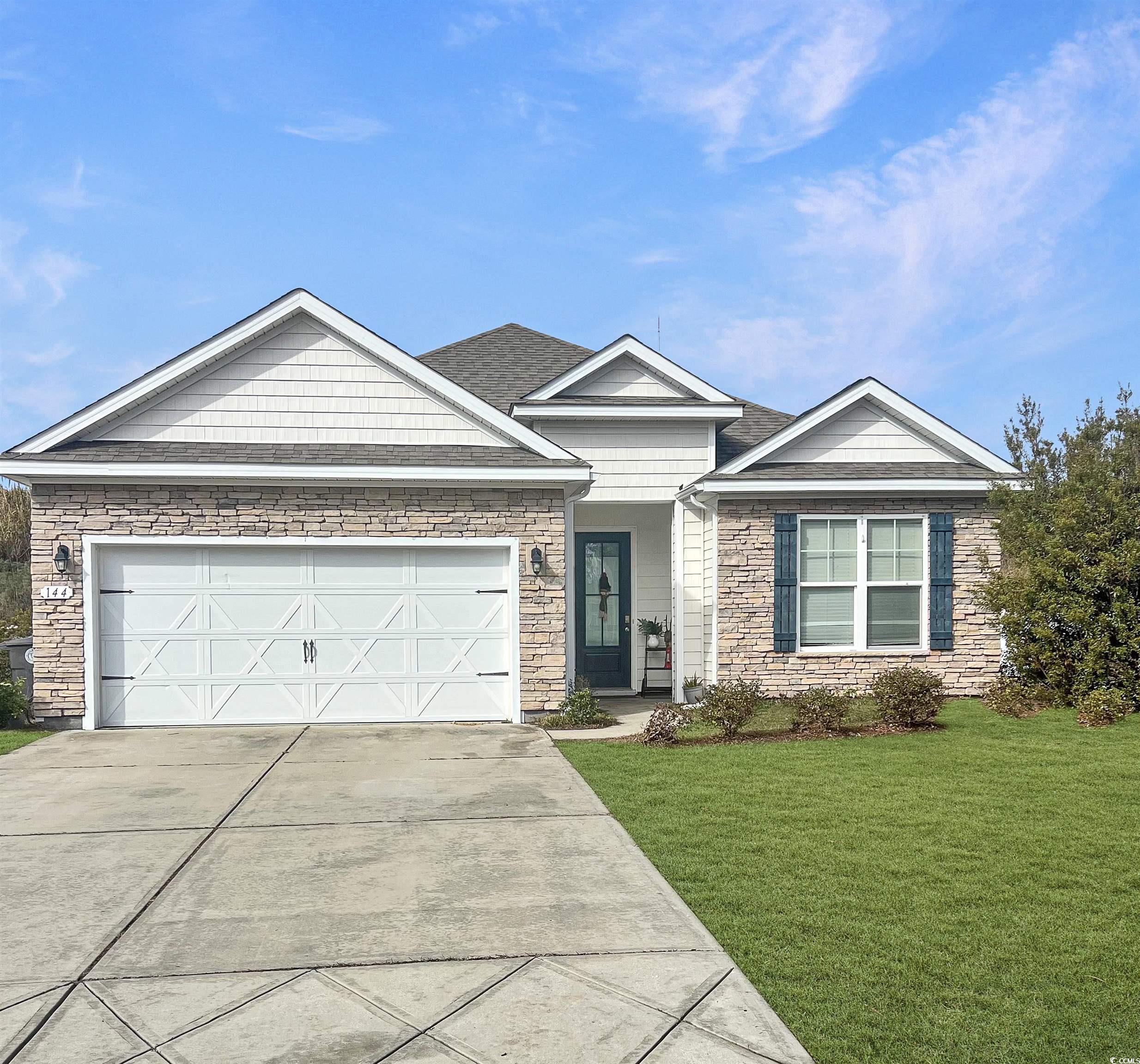 144 Bucky Loop Murrells Inlet, SC 29576 - Photo 37 of 40 Ranch-style home with a garage and a front yard