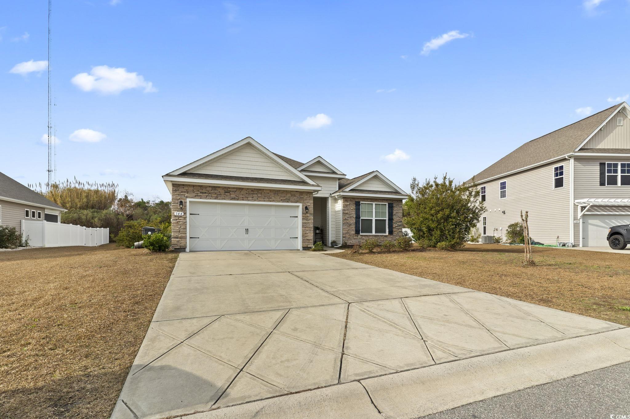 144 Bucky Loop Murrells Inlet, SC 29576 - Photo 4 of 40 View of front of house with a garage