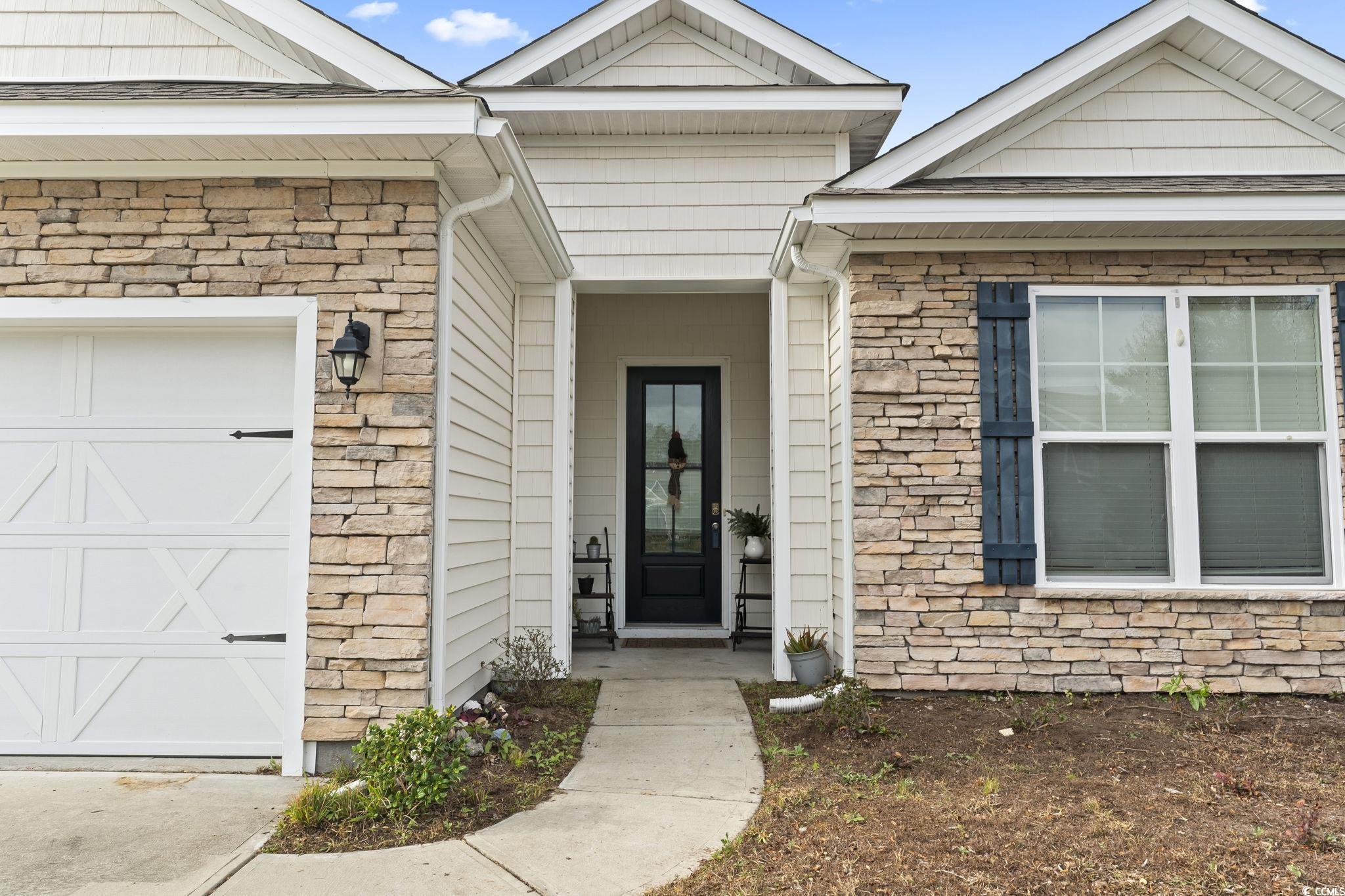 144 Bucky Loop Murrells Inlet, SC 29576 - Photo 5 of 40 Property entrance featuring a garage