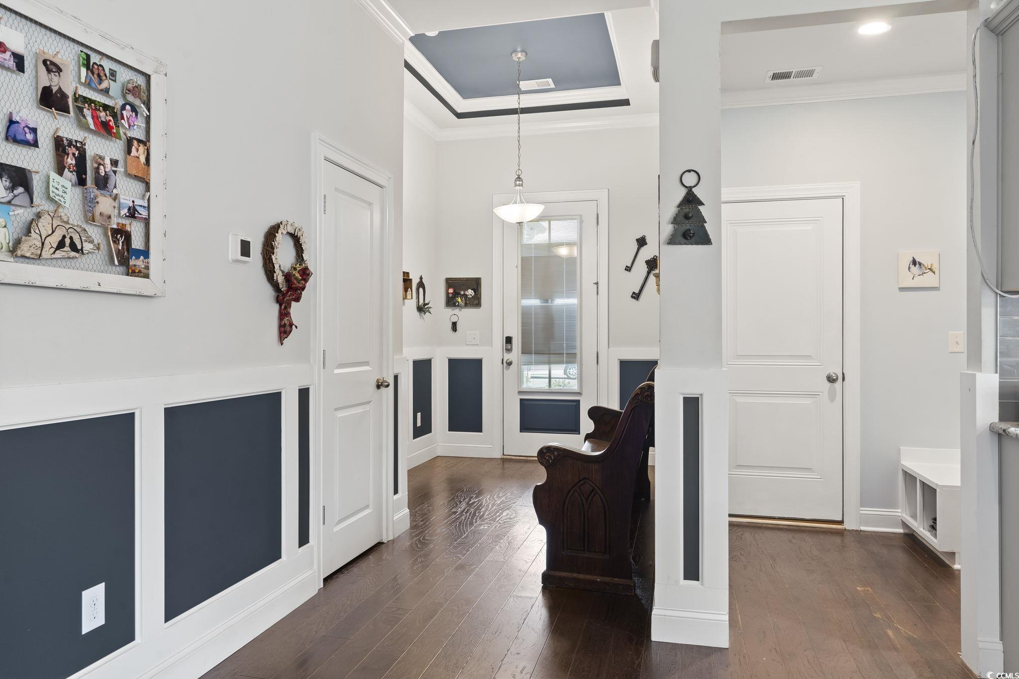 144 Bucky Loop Murrells Inlet, SC 29576 - Photo 8 of 40 Corridor featuring dark hardwood / wood-style floo