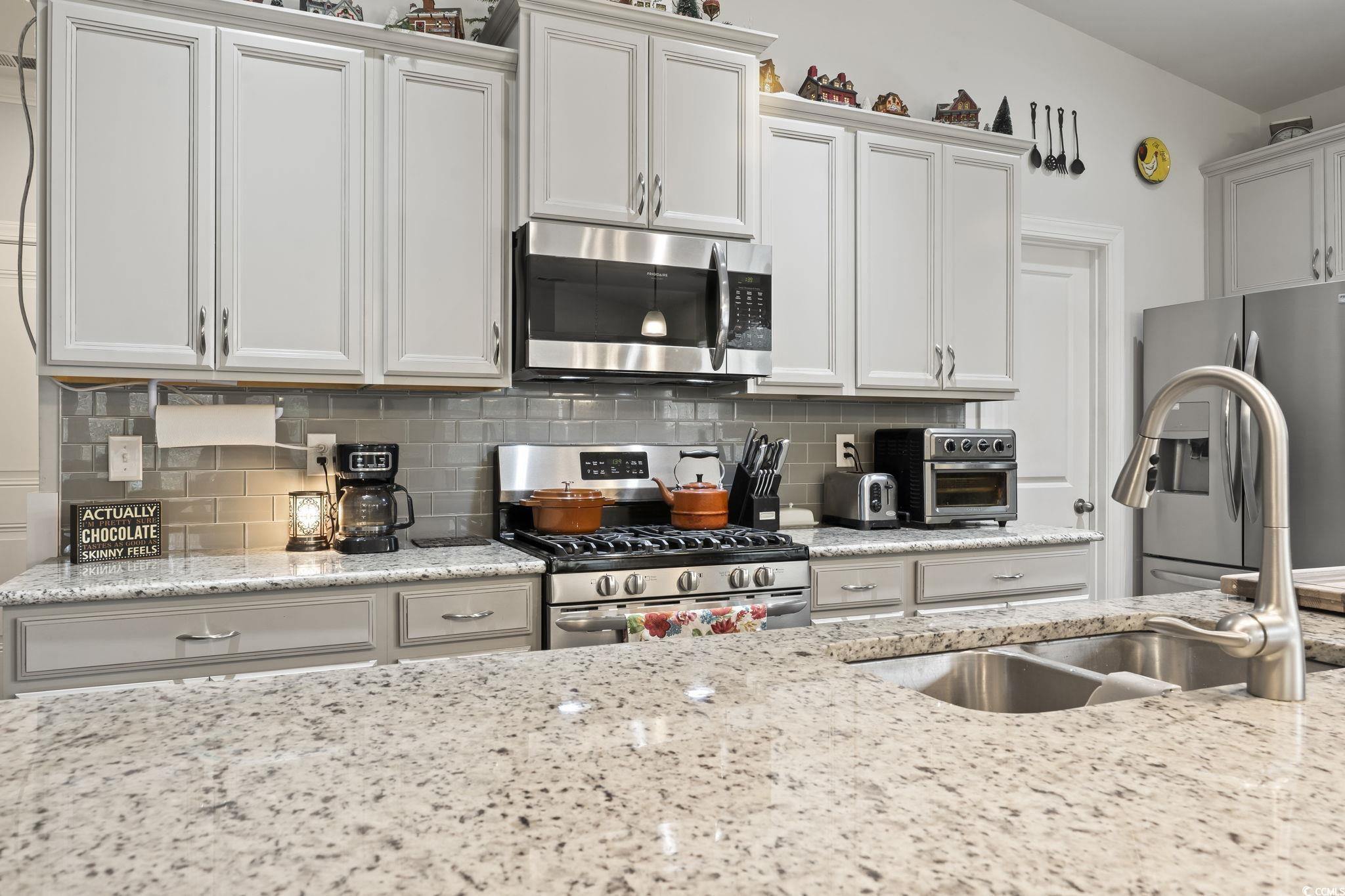 144 Bucky Loop Murrells Inlet, SC 29576 - Photo 9 of 40 Kitchen with white cabinets, stainless steel appli