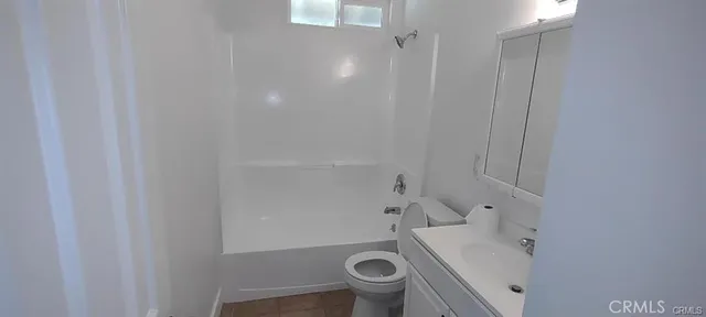 a bathroom with a shower and toilet