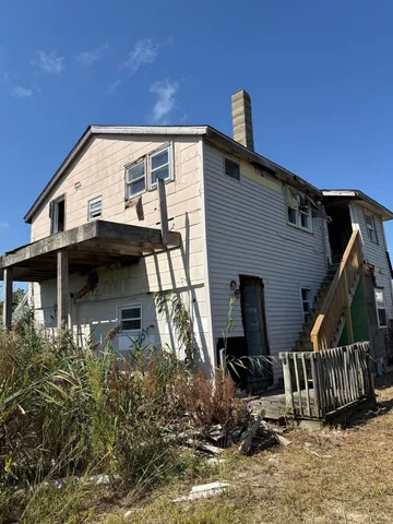 a view of a house with large windows