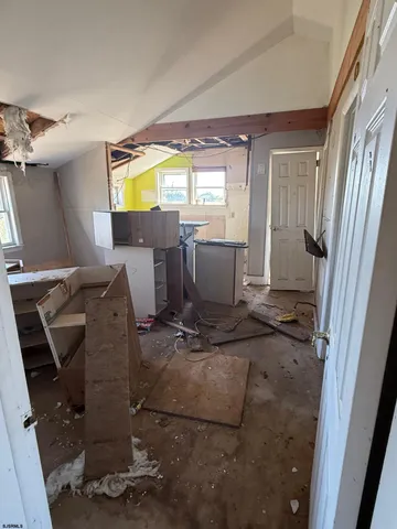 a view of a living room with furniture and a window