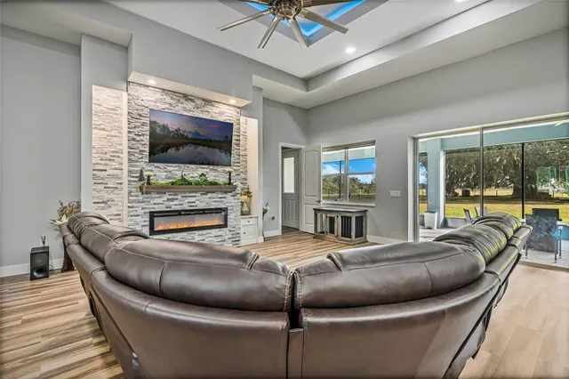 a kitchen with stainless steel appliances granite countertop a table chairs and granite counter tops