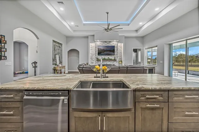 a room with furniture a flat screen tv and a window