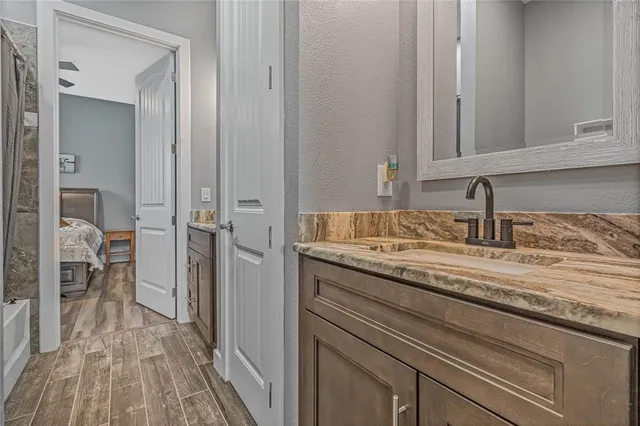 a bathroom with a sink and a mirror