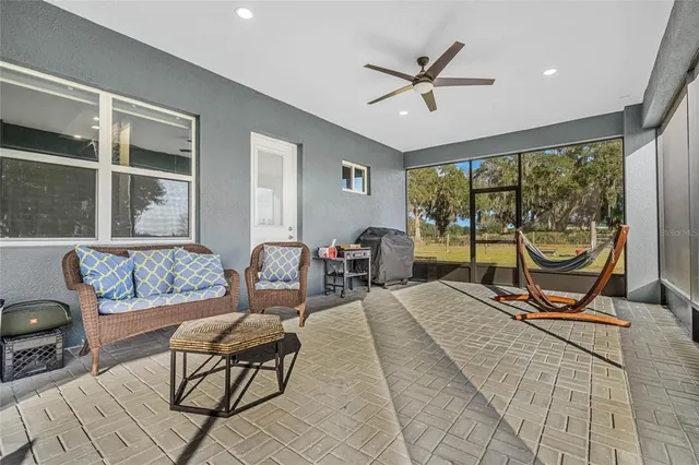 a view of a swimming pool and lounge chair