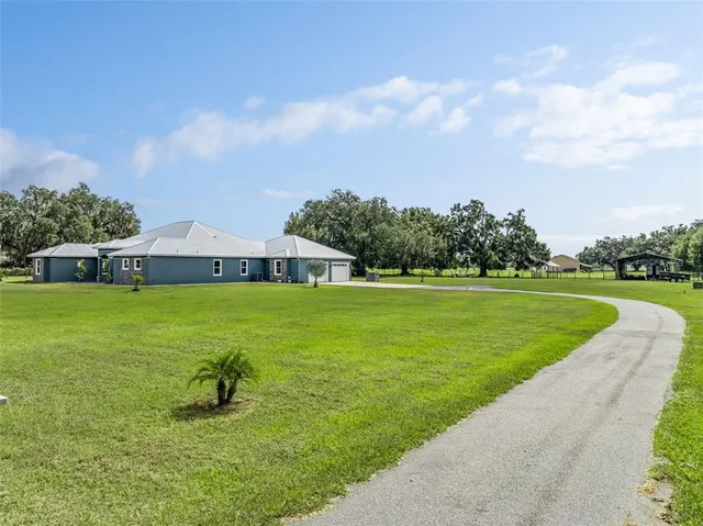 a view of a house with a big yard