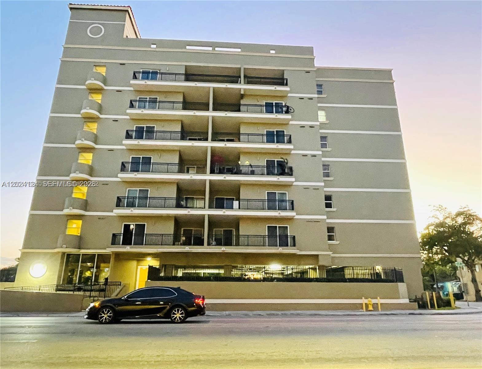 120 South Douglas Road, Unit 302 Miami, FL 33134 - Photo 25 of 28 a view of a car parked in front of a building