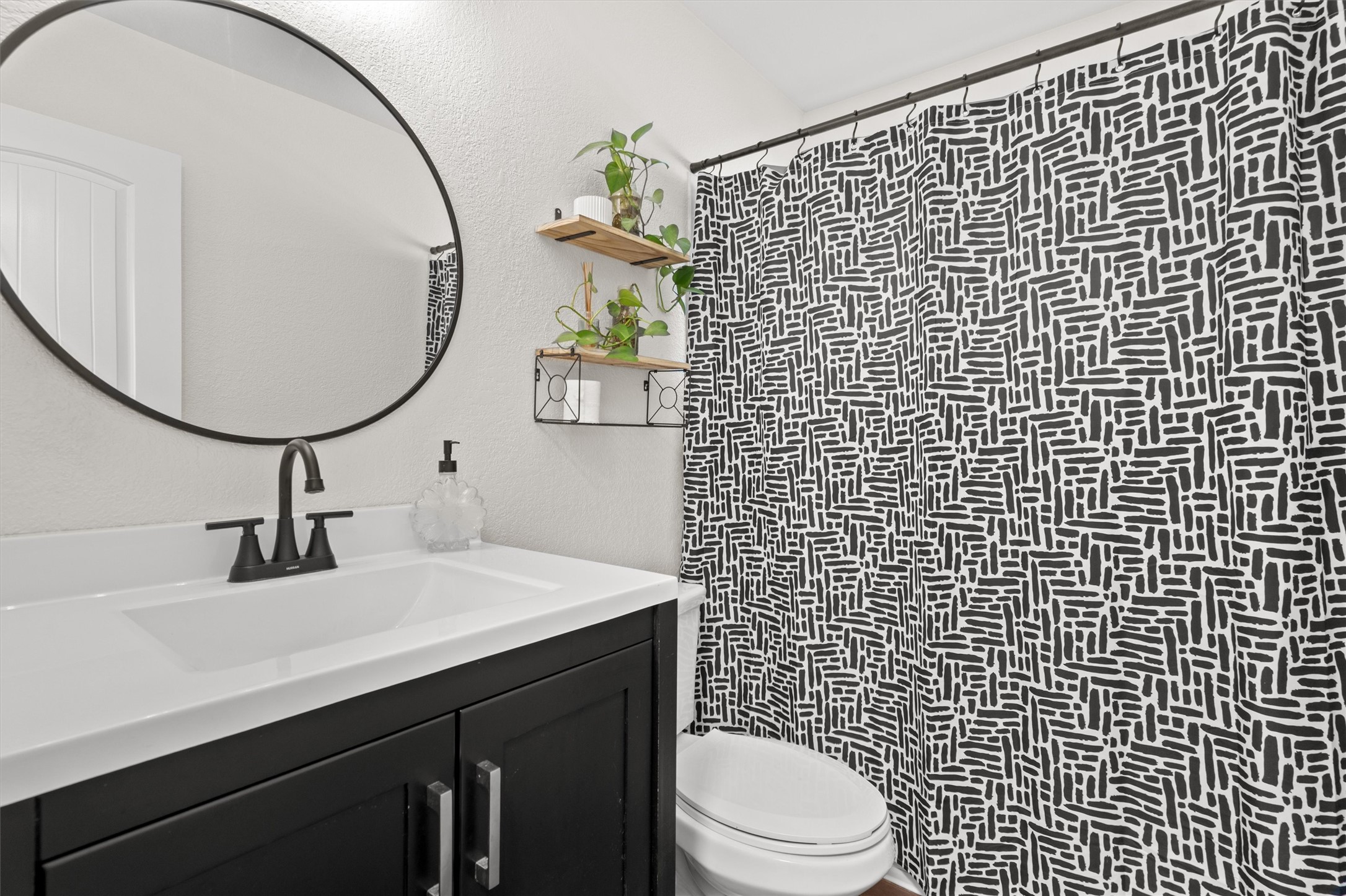 606 Old Peak Road Georgetown, TX 78626 - Photo 8 of 23 a bathroom with a sink toilet and a mirror