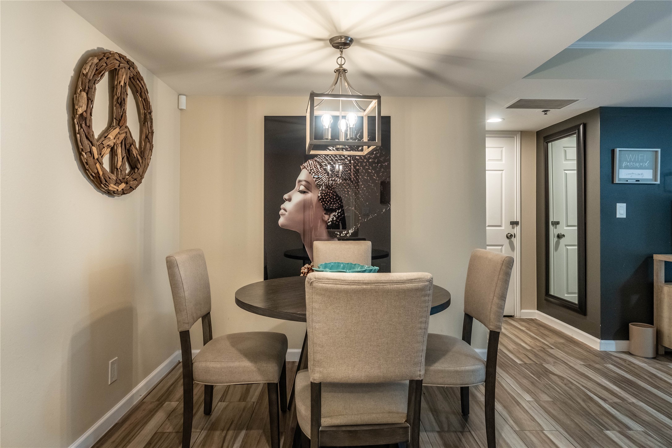 3525 Sage Road, Unit 913 Houston, TX 77056 - Photo 4 of 22 a view of a dining room with furniture and wooden floor