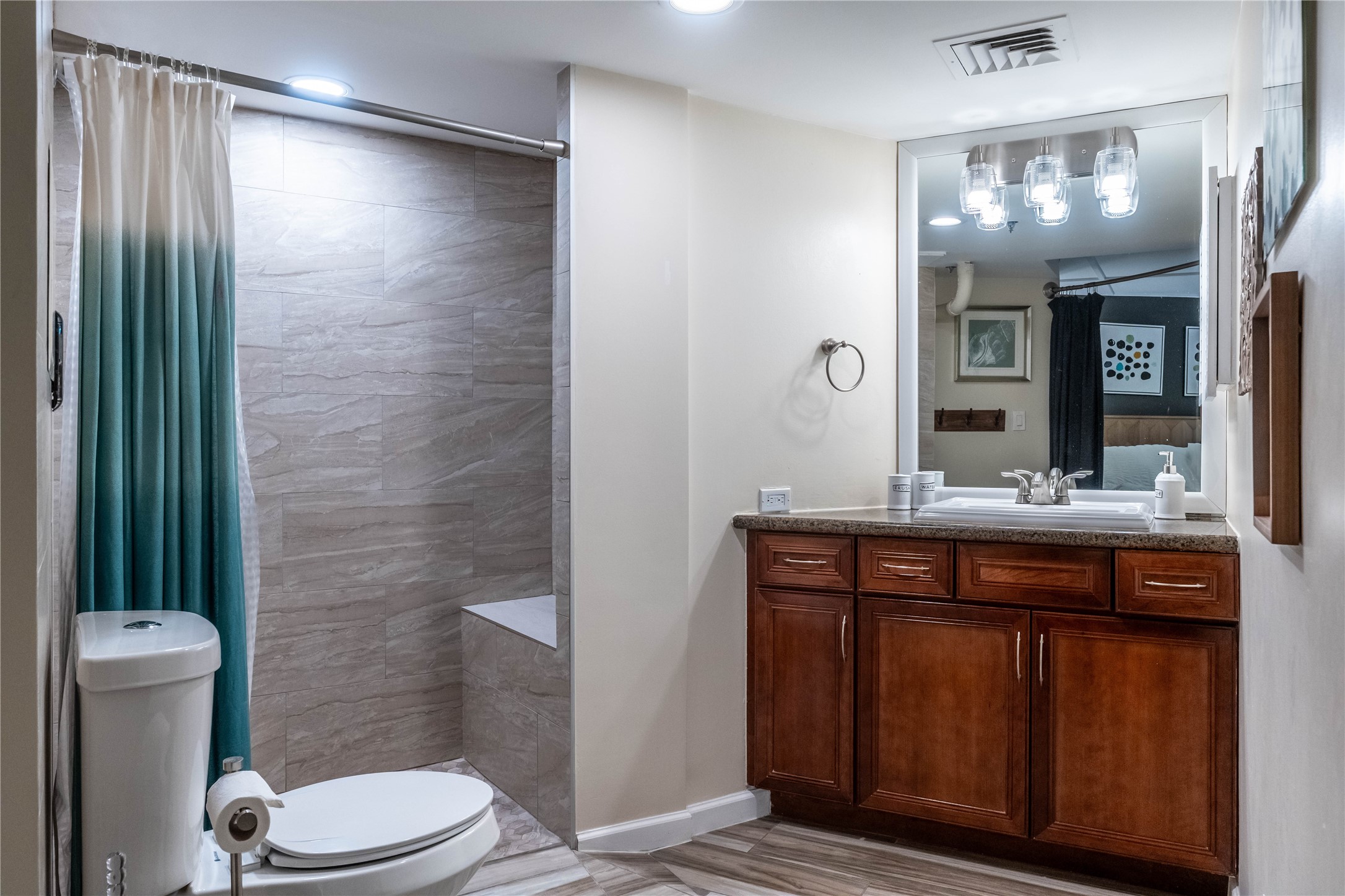 3525 Sage Road, Unit 913 Houston, TX 77056 - Photo 9 of 22 a bathroom with a granite countertop sink toilet and shower