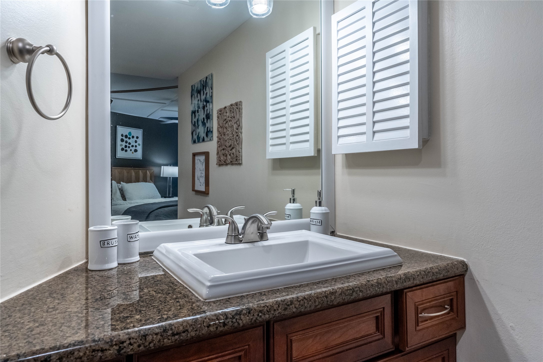 3525 Sage Road, Unit 913 Houston, TX 77056 - Photo 10 of 22 a bathroom with a granite countertop sink a mirror and a window
