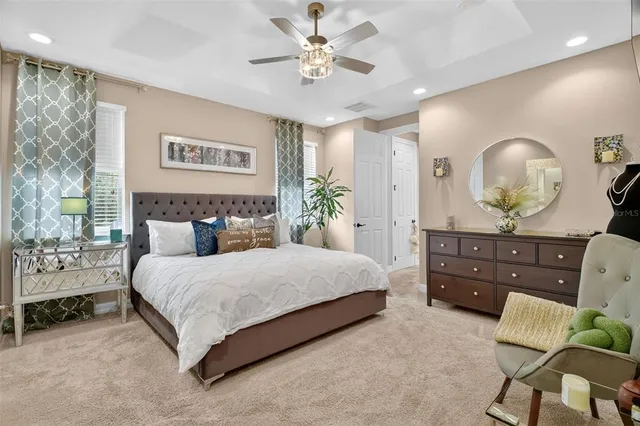 a view of a kitchen with stainless steel appliances granite countertop a sink and a wooden floor
