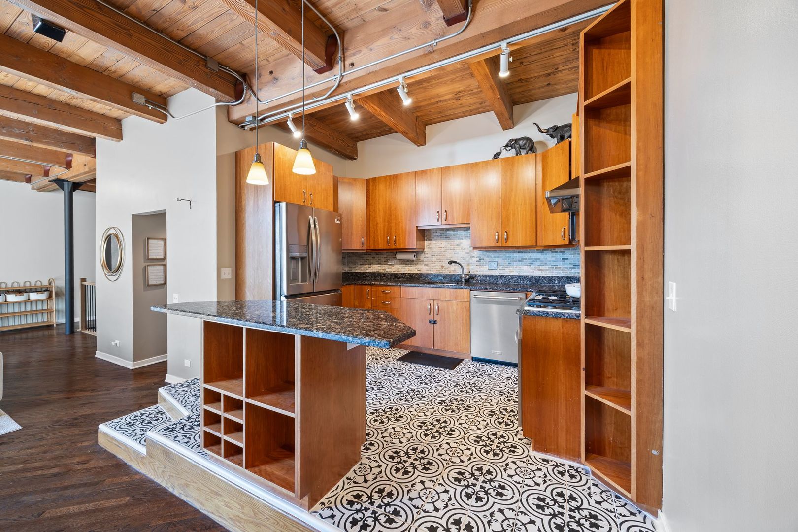 2222 North Racine Avenue, Unit 12 Chicago, IL 60614 - Photo 12 of 37 a room with stainless steel appliances kitchen island granite countertop a sink and cabinets
