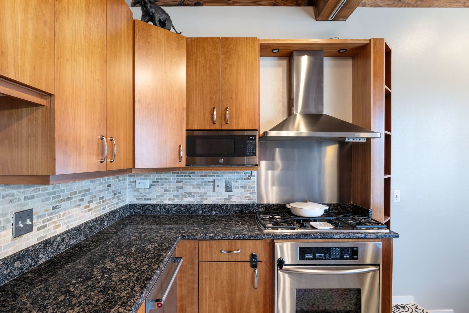 2222 North Racine Avenue, Unit 12 Chicago, IL 60614 - Photo 14 of 37 a kitchen with a stove and a microwave