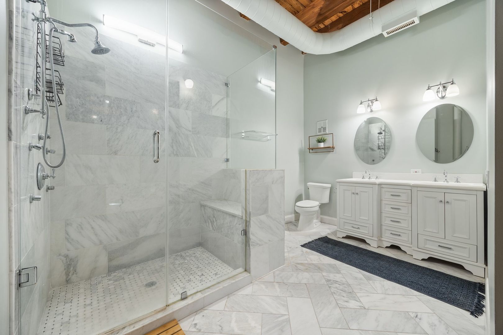 2222 North Racine Avenue, Unit 12 Chicago, IL 60614 - Photo 22 of 37 a bathroom with a double vanity sink mirror and shower