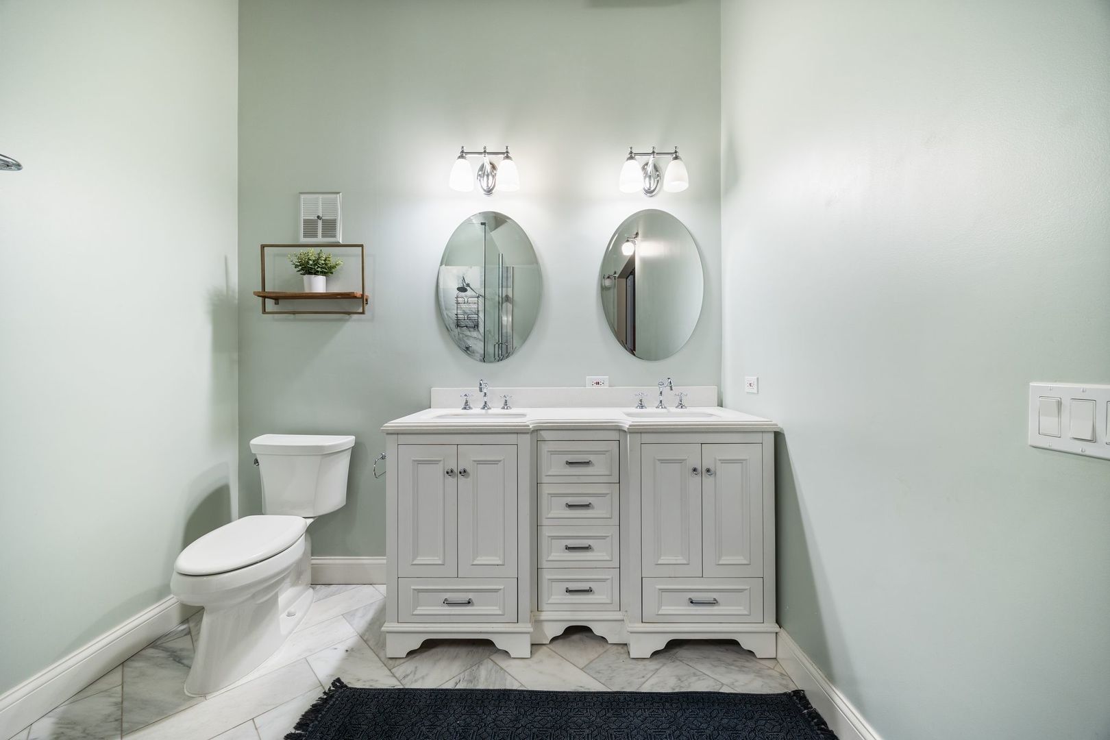 2222 North Racine Avenue, Unit 12 Chicago, IL 60614 - Photo 23 of 37 a bathroom with a toilet a sink and a mirror