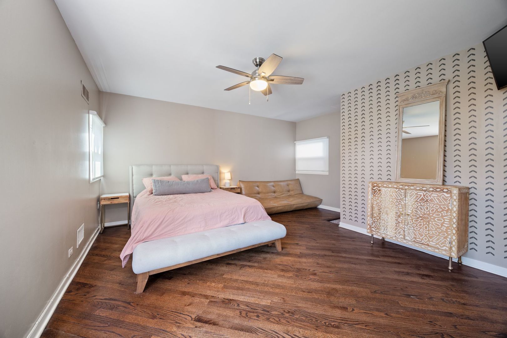 2222 North Racine Avenue, Unit 12 Chicago, IL 60614 - Photo 29 of 37 a bedroom with a bed chandelier and a window