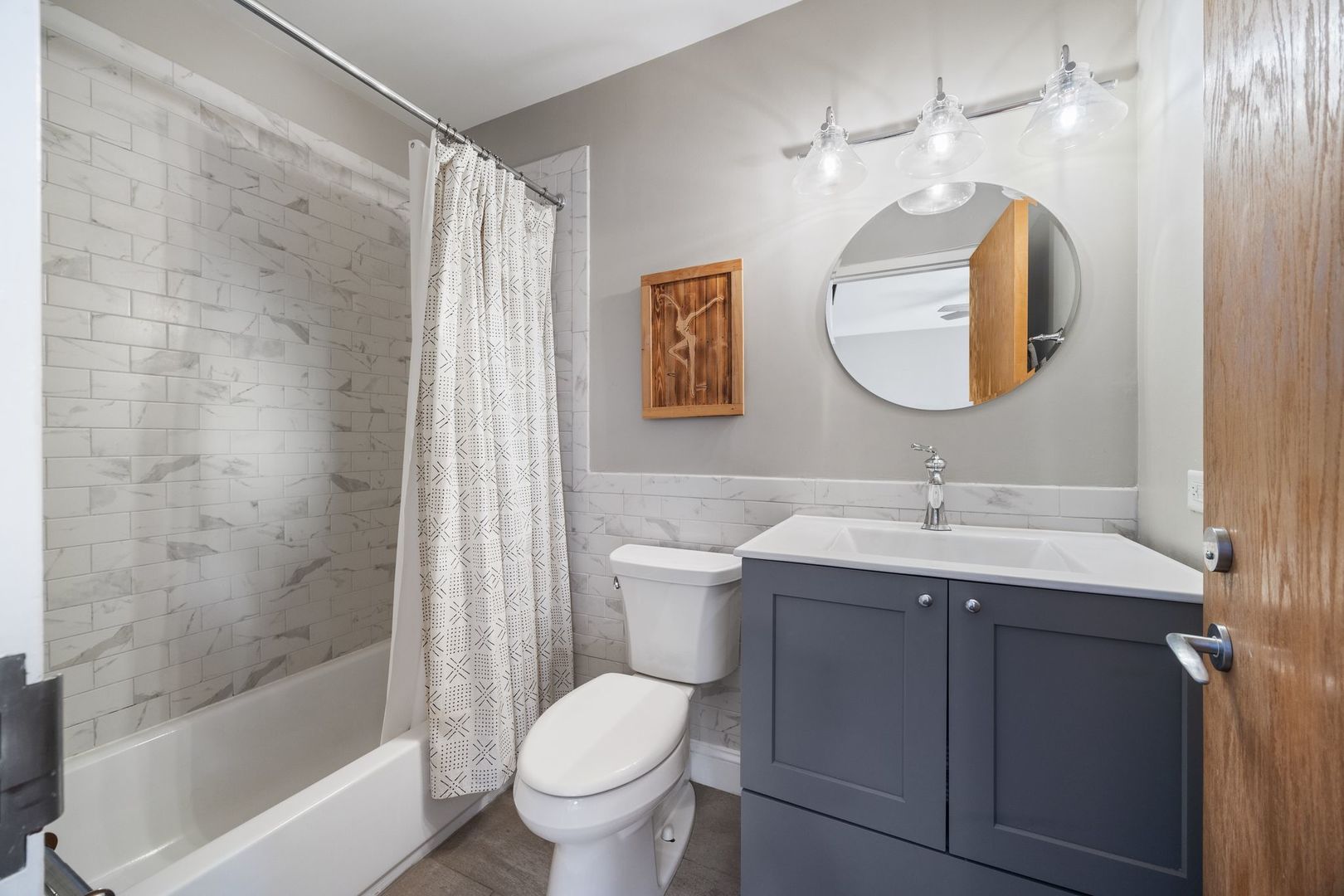 2222 North Racine Avenue, Unit 12 Chicago, IL 60614 - Photo 30 of 37 a bathroom with a toilet sink and mirror