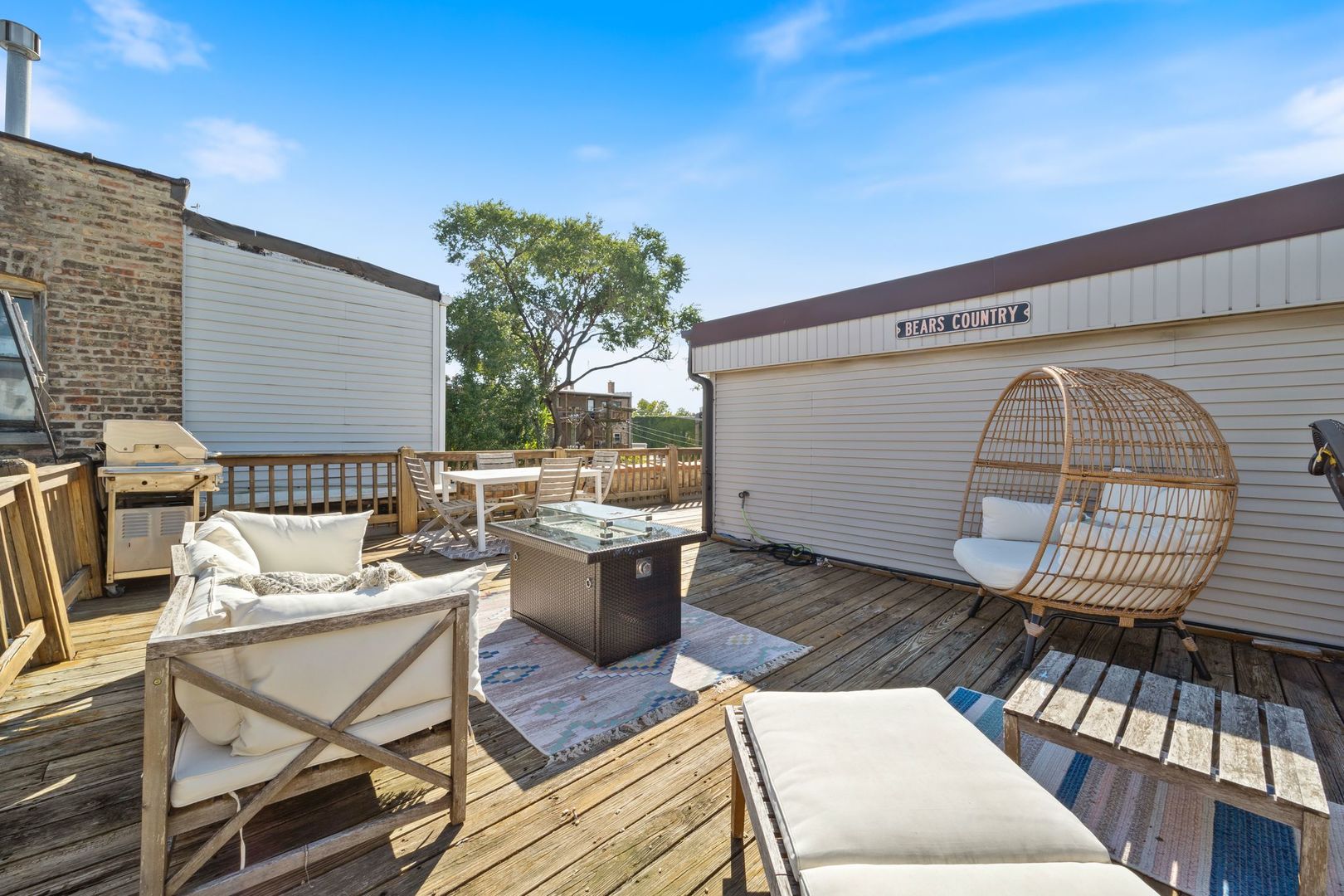 2222 North Racine Avenue, Unit 12 Chicago, IL 60614 - Photo 31 of 37 a view of a patio with table and chairs with wooden floor and fence