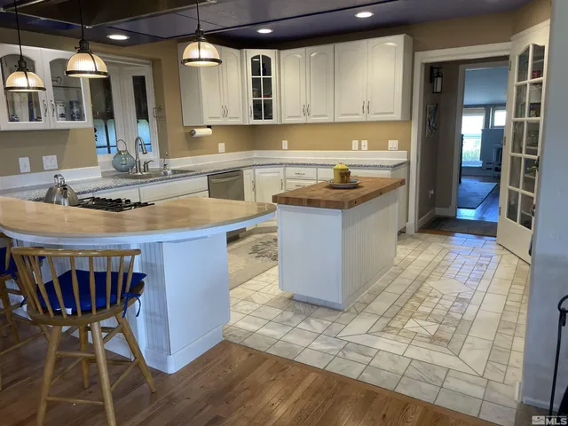 a view of a chairs and table in a room