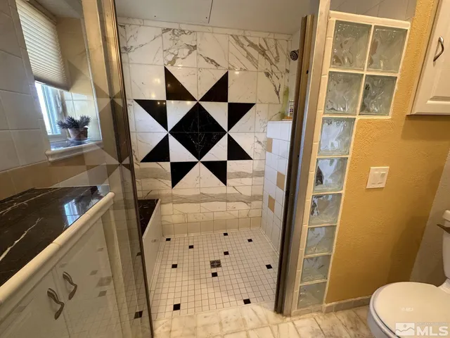 a view of a house with a yard and a mountain view