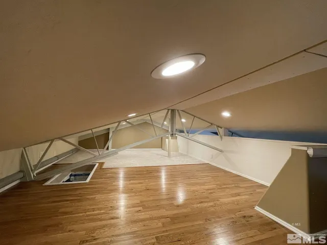 a kitchen with cabinets and window