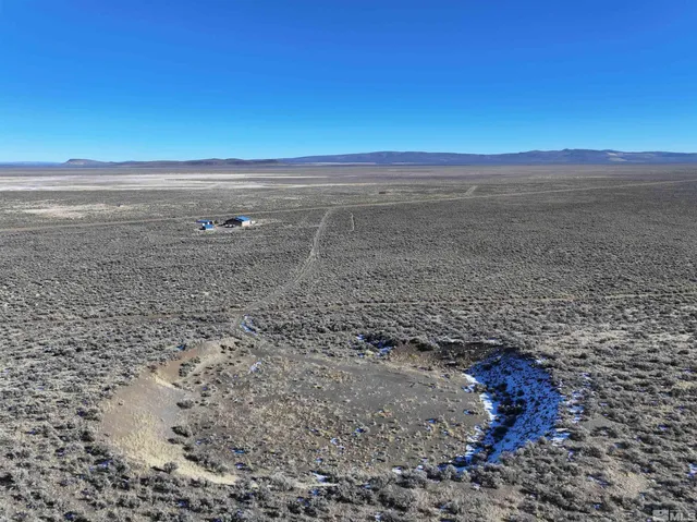 a bathroom with a sink a mirror and a shower