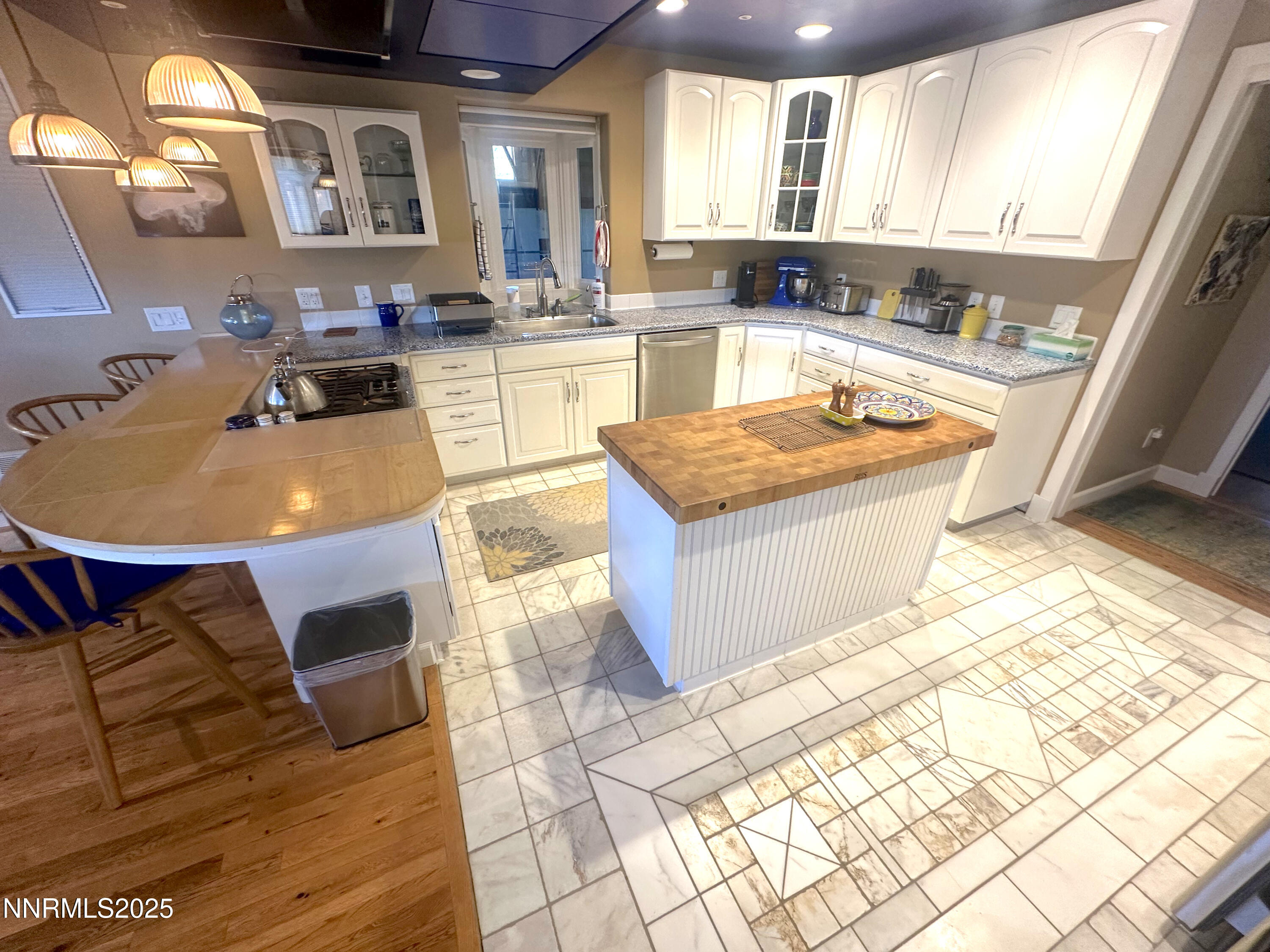 93205 State Route 34 Gerlach, NV 89412 - Photo 55 of 70 a large kitchen with granite countertop a stove a sink a dining table and chair