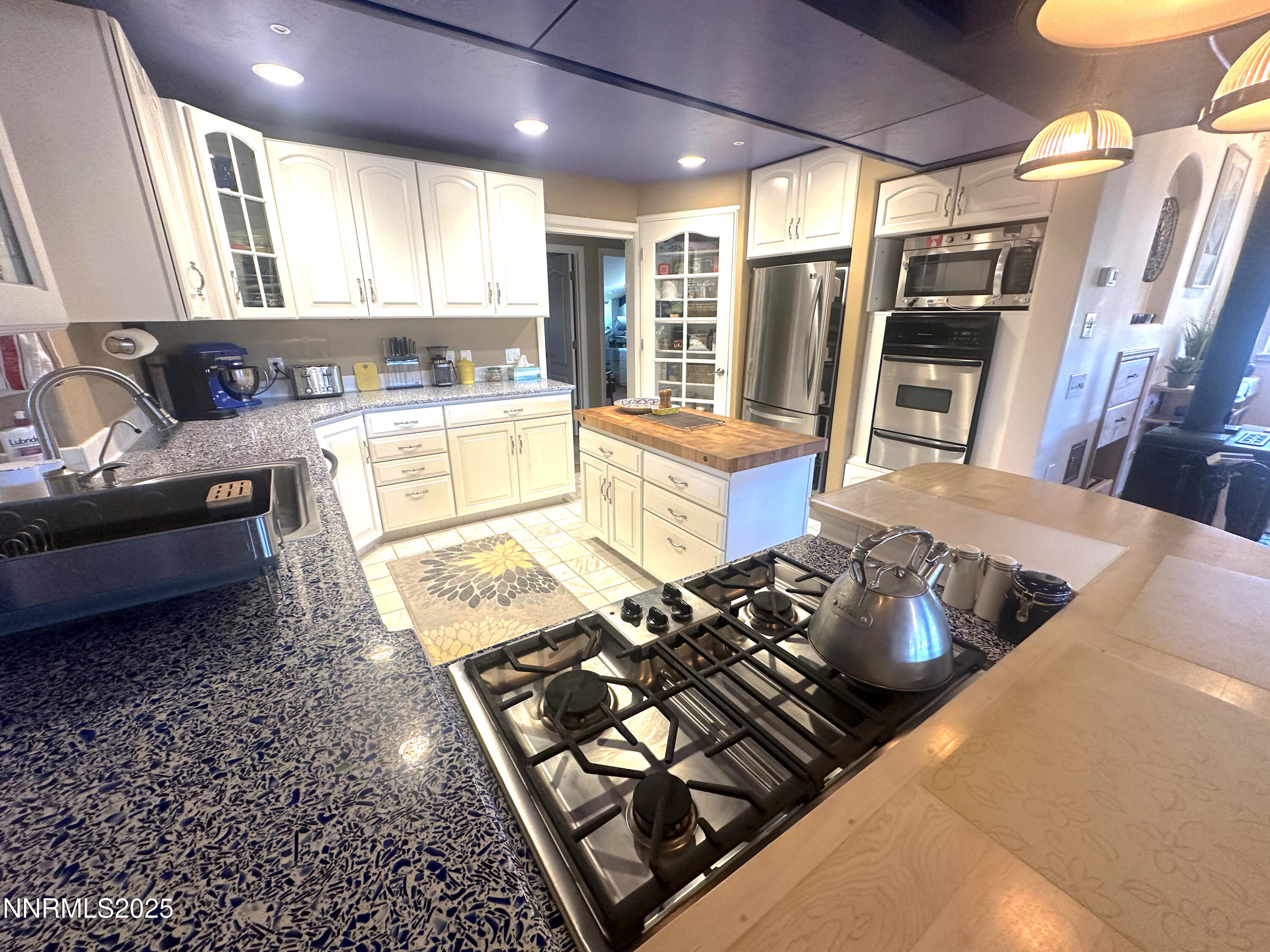 93205 State Route 34 Gerlach, NV 89412 - Photo 56 of 70 a bed sitting in a kitchen next to a window