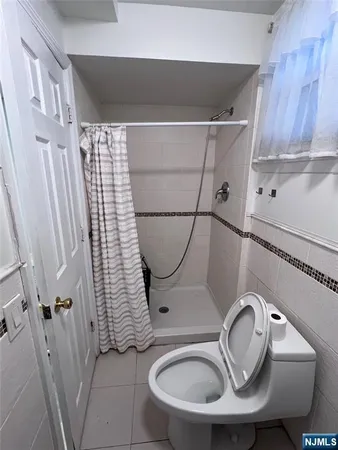 a bathroom with a sink toilet and mirror