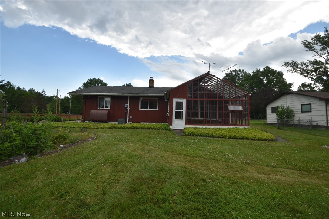 12840 South Reed Road Grafton, OH 44044 - Photo 20 of 27 Rear view of property with a lawn