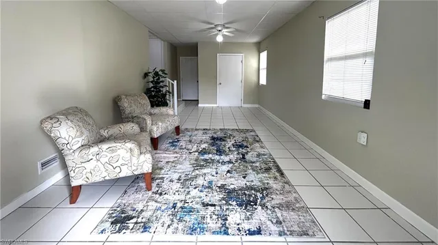 a living room with furniture and a rug