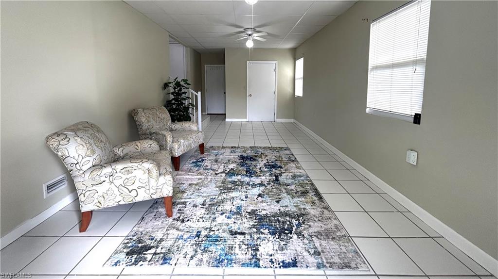 Undisclosed Address Naples, FL 34114 - Photo 3 of 20 a living room with furniture and a rug