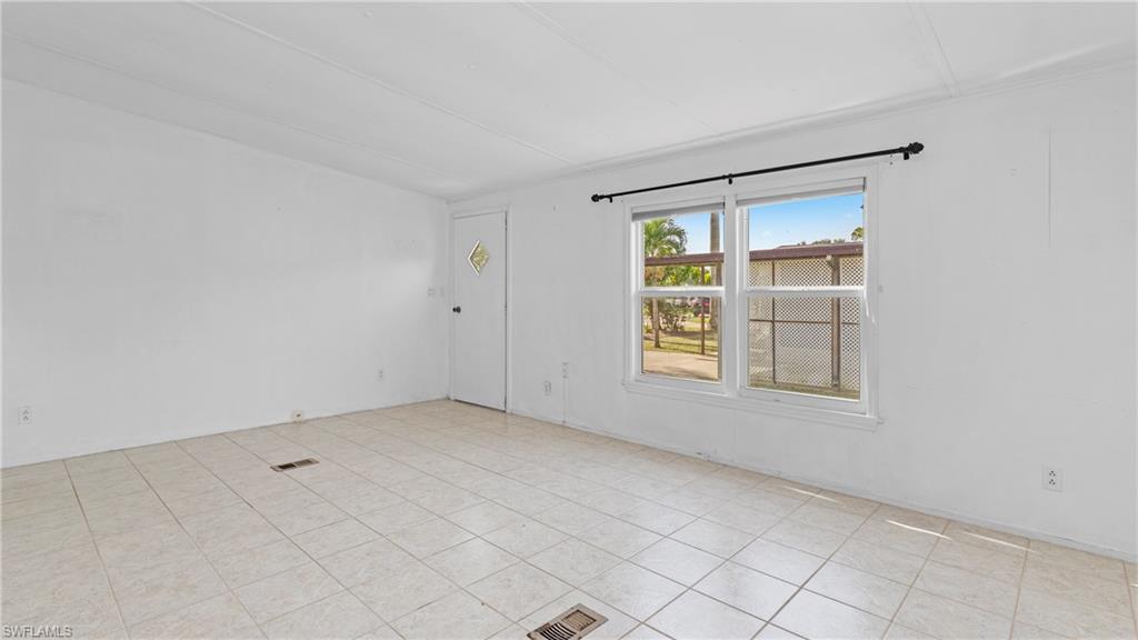 Undisclosed Address Naples, FL 34114 - Photo 6 of 20 an empty room with windows