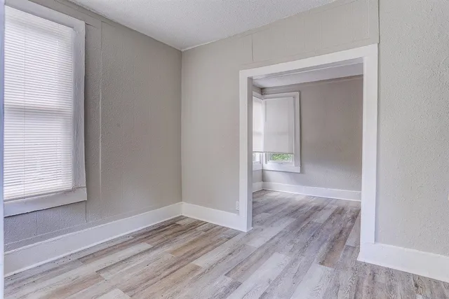 a view of wooden floor in an empty room