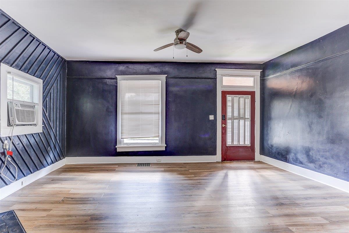 2006 Felix Avenue Memphis, TN 38104 - Photo 20 of 37 an empty room with wooden floor and windows