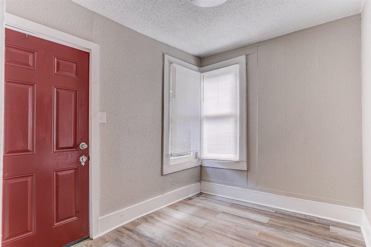 2006 Felix Avenue Memphis, TN 38104 - Photo 32 of 37 an empty room with wooden floor and windows