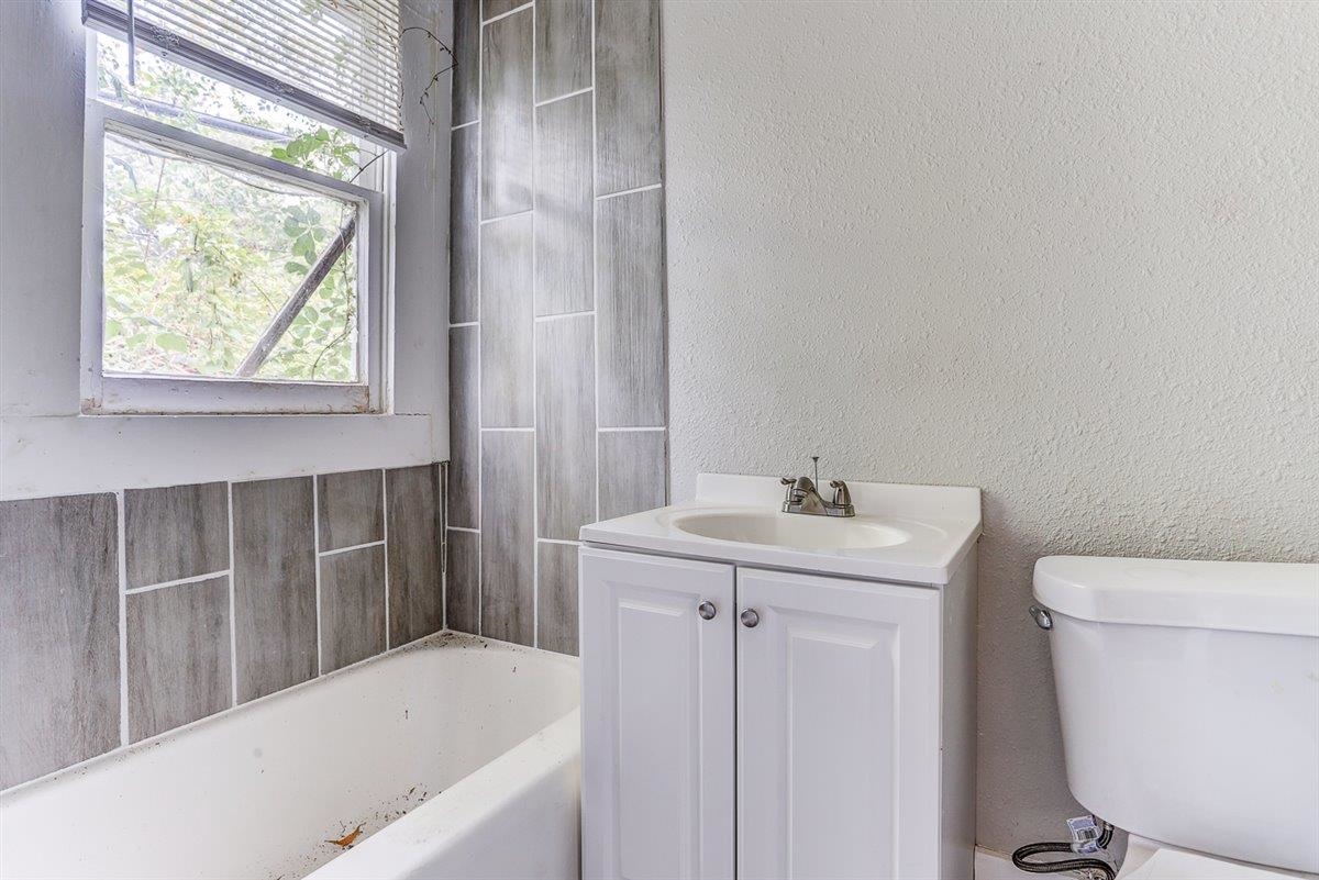 2006 Felix Avenue Memphis, TN 38104 - Photo 35 of 37 a bathroom with a sink a toilet and tub