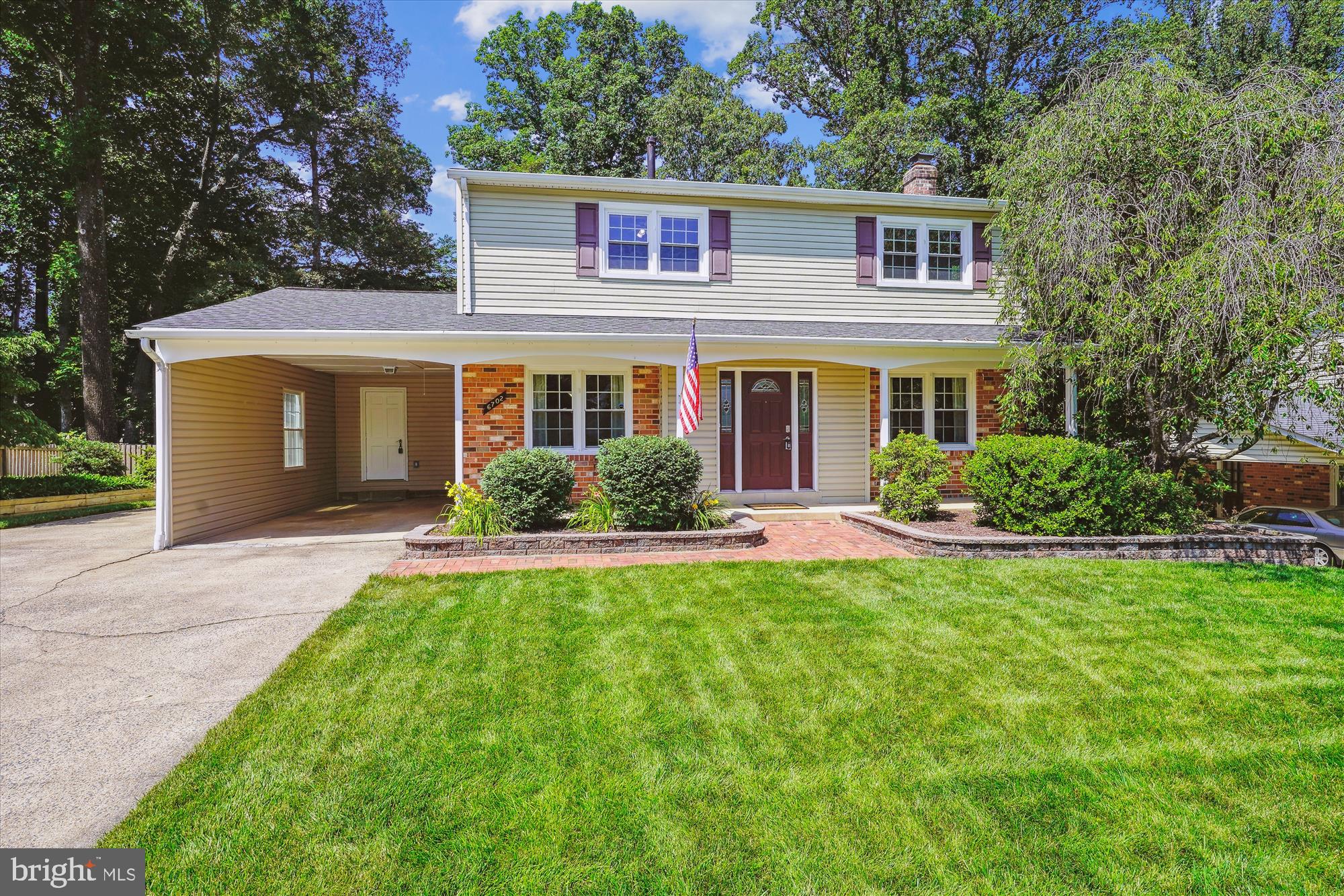 6702 Red Jacket Road Springfield, VA 22152 - Photo 54 of 57 a front view of a house with a yard and garage