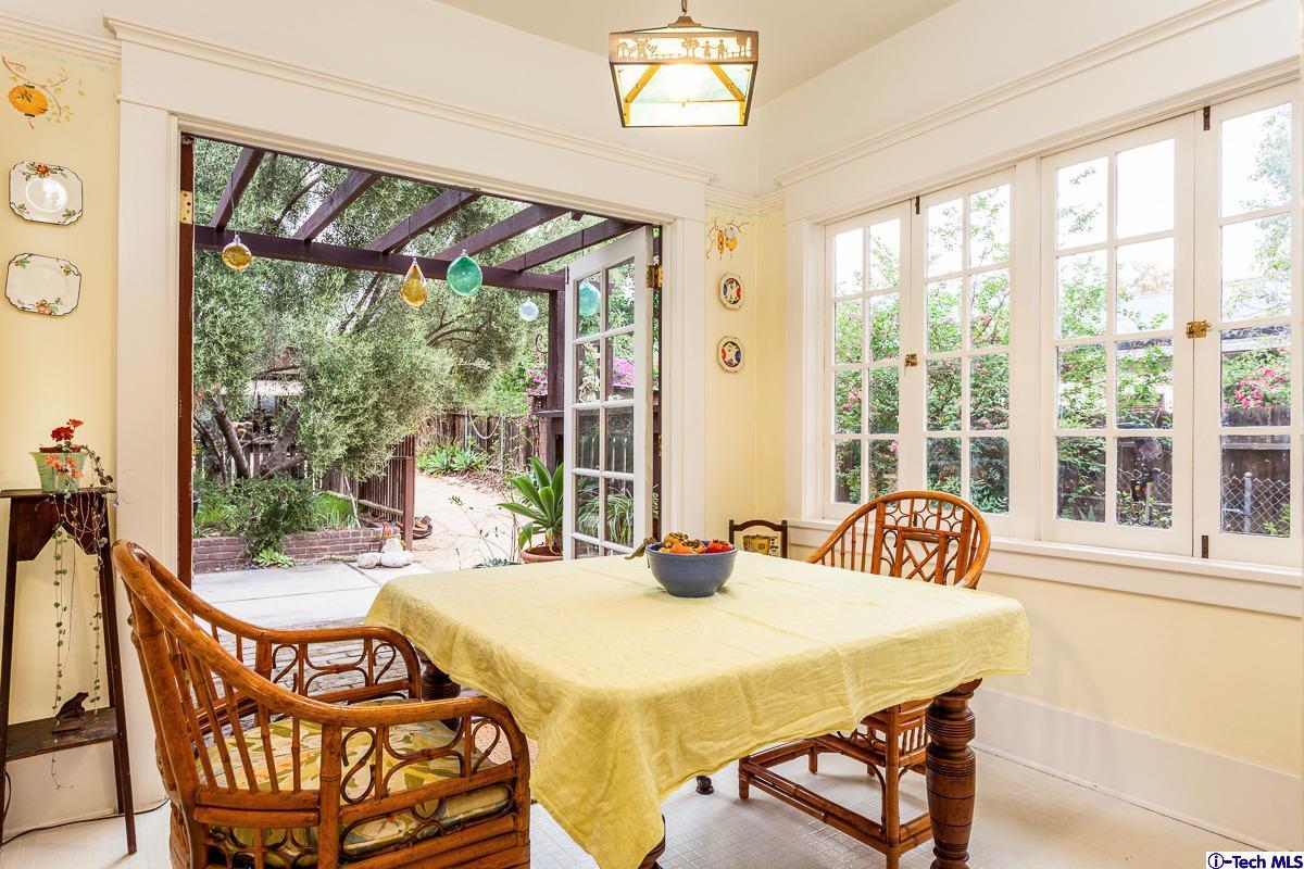 1255 Morada Place Altadena, CA 91001 - Photo 12 of 37 a view of a dining room with furniture large windows and wooden floor