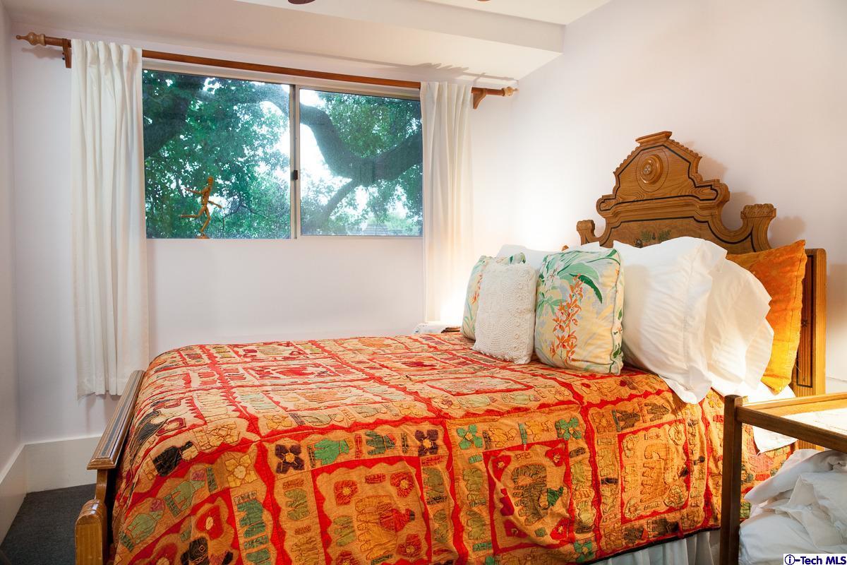1255 Morada Place Altadena, CA 91001 - Photo 21 of 37 a bedroom with a bed and window