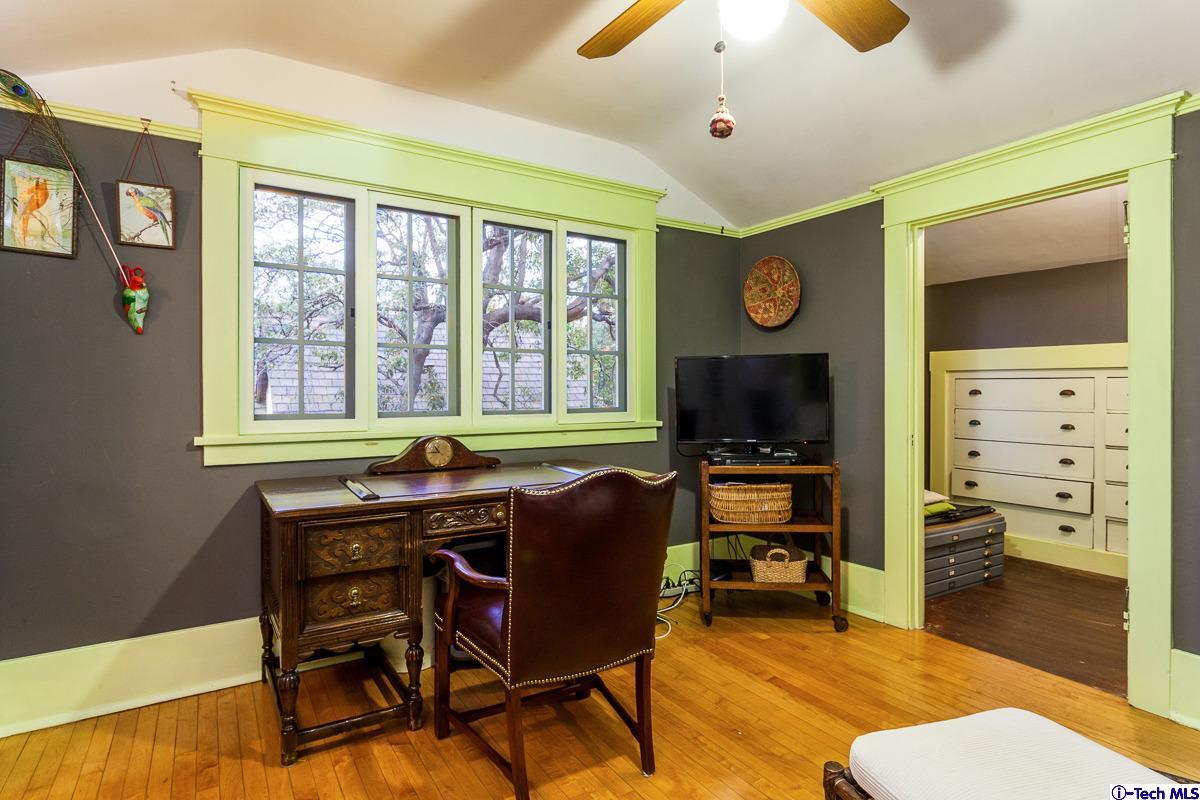 1255 Morada Place Altadena, CA 91001 - Photo 25 of 37 a living room with furniture a flat screen tv and a large window