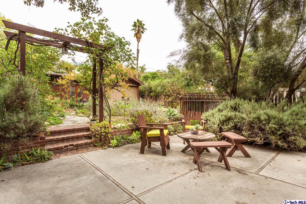 1255 Morada Place Altadena, CA 91001 - Photo 28 of 37 a view of a bench and chairs in a backyard
