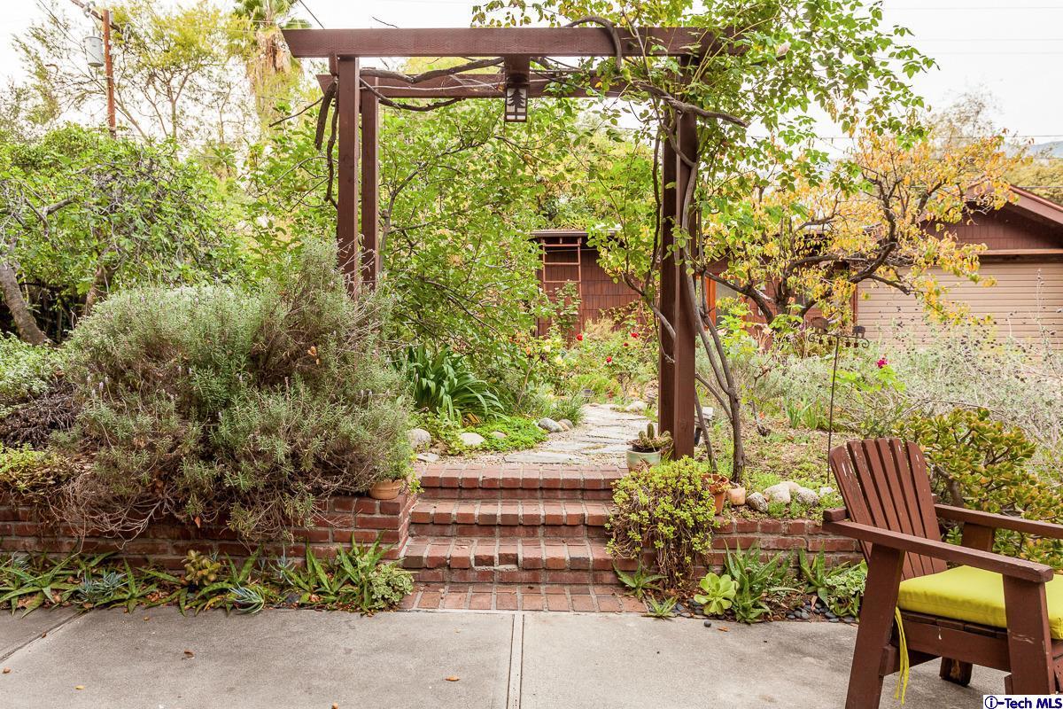 1255 Morada Place Altadena, CA 91001 - Photo 34 of 37 a view of a yard with plants and large trees
